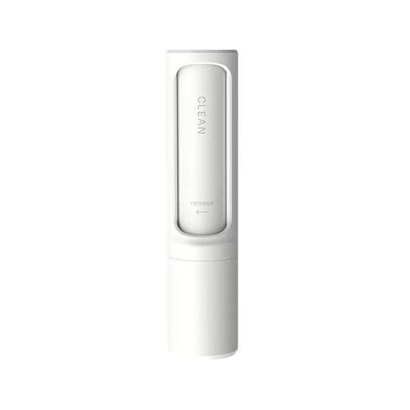 Reusable pet hair roller cleaning a couch
